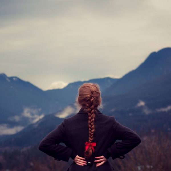 woman facing a mountain
