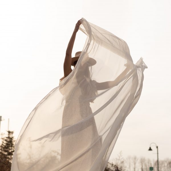 woman waving a silk cloth
