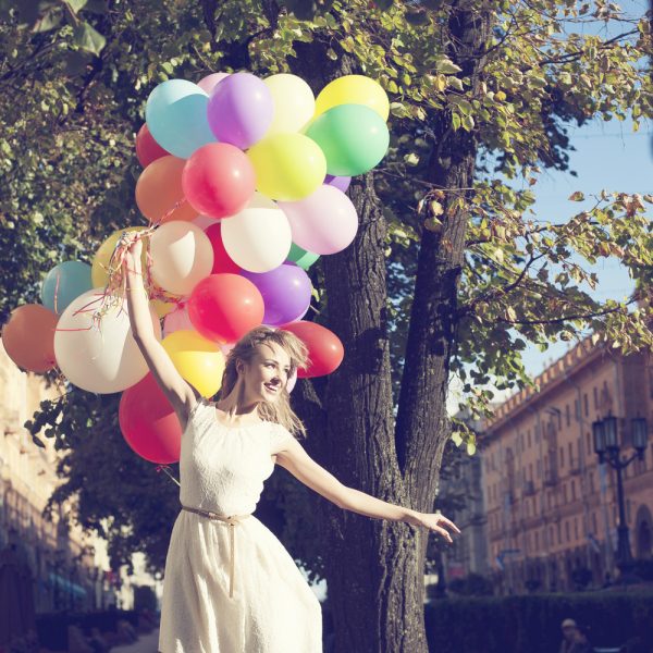 woman with a buch of balloons